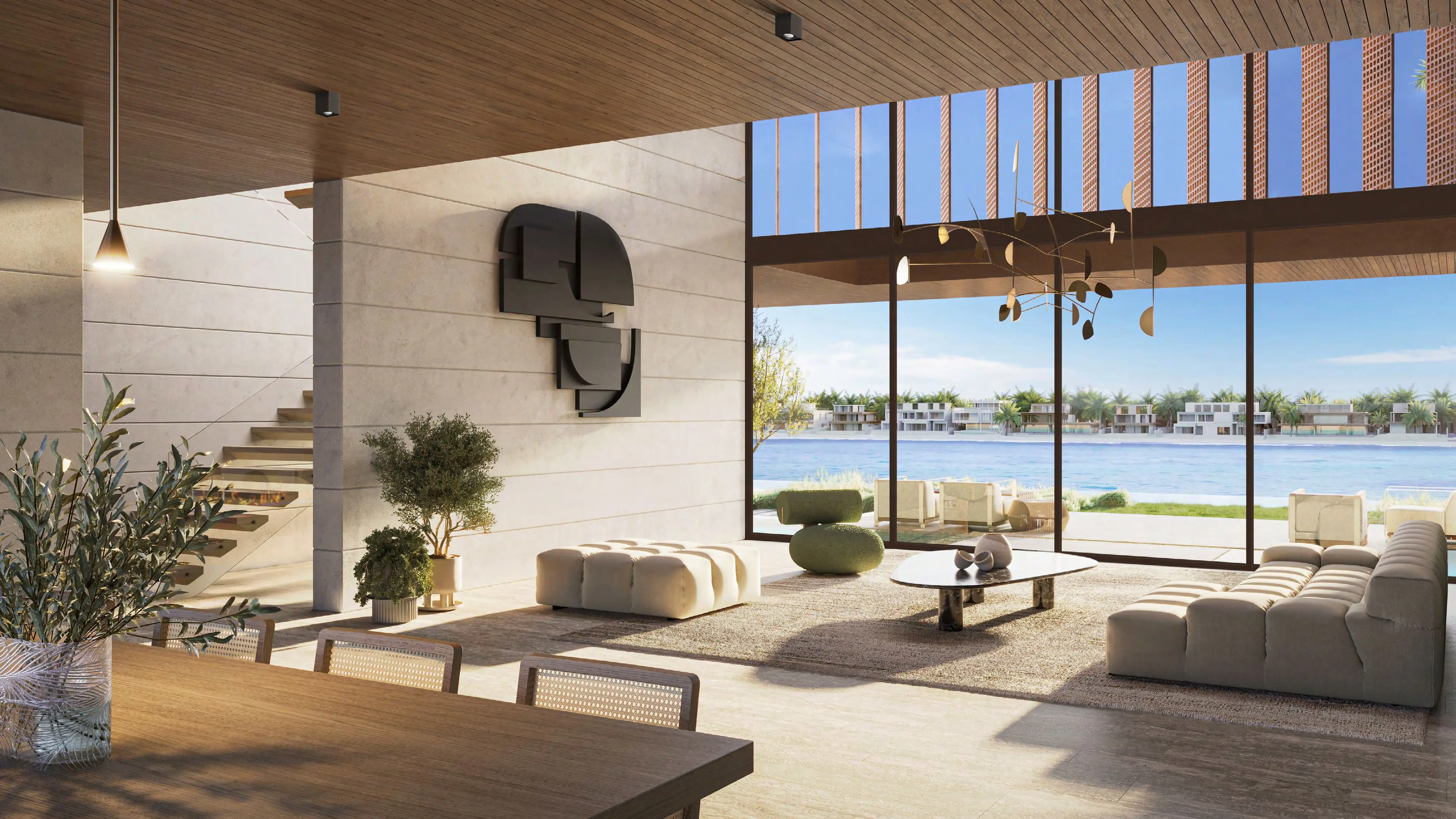 Double-height living room with floor-to-ceiling glass overlooking the lagoon